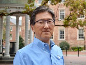 headshot of Koji Sode in front of the UNC Old Well